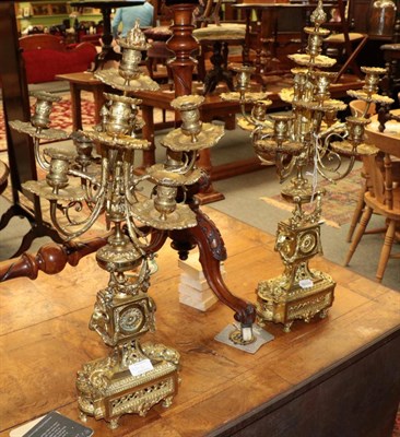 Lot 339 - ^ A pair of gilt metal eight branch candelabra in the Adams style