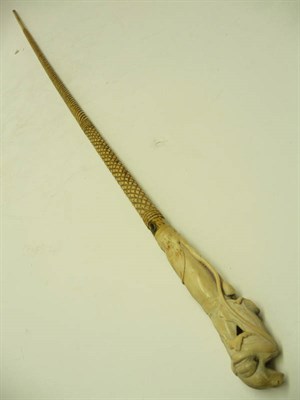 Lot 1228 - A Bone Walking Stick, late 19th century, the handle carved as a frog on a lily pad, the stick...