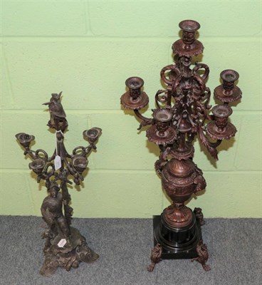 Lot 371 - ^ A late 19th/early 20th century cast metal five branch candelabrum, modelled as a gentleman with a