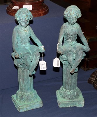 Lot 372 - Pair of girls reading on columns