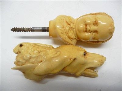 Lot 1231 - A Carved Ivory Cane Handle, 19th century, as the head of a dog and a rabbit, each with glass...