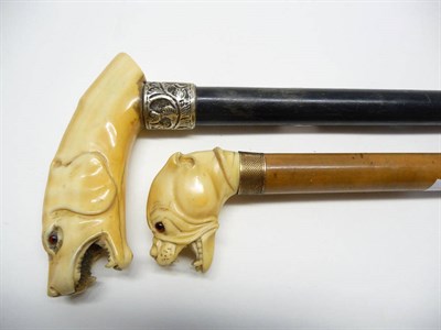 Lot 1232 - An Ivory Mounted Malacca Walking Cane, late 19th century, the handle formed as the head of a...