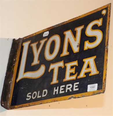 Lot 1080 - ^ A double sided enamel advertising sign with mounting flange ''Lyons Tea Sold Here'', 30cm by 45cm