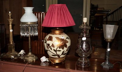Lot 1089 - ^ A brass Corinthian column table lamp, a brass table lamp with opaque glass shade and lustre...