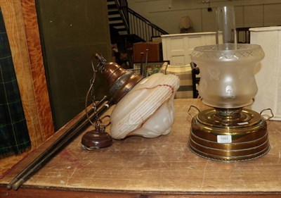Lot 1093 - An Ardent brass heating lamp with etched moulded shade, together with a marbled glass ceiling light