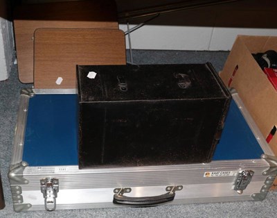Lot 1141 - A large flight case; a magic lantern and a stand