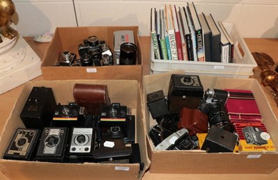 Lot 1147 - Four boxes of cameras and photographic books including two Pentax XV's; Cannon TB; Cannon RT etc