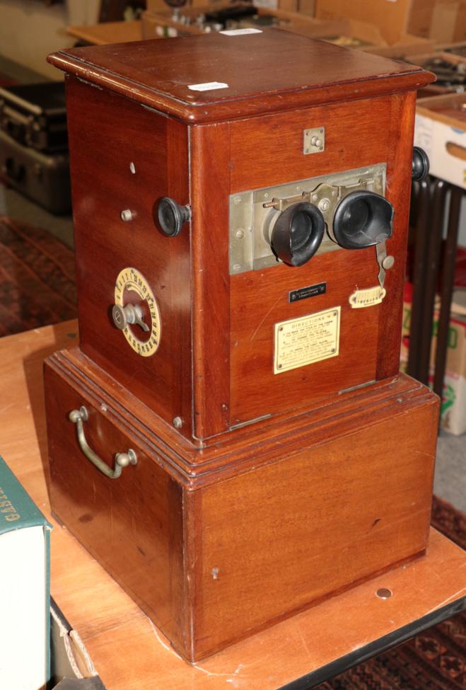 Lot 1159 - A London Stereoscopic Company table top stereo viewer with slides