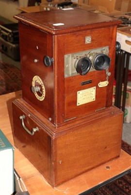 Lot 1159 - A London Stereoscopic Company table top stereo viewer with slides