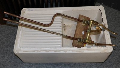 Lot 1189 - ^ A Belfast sink and brass taps