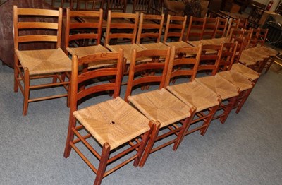 Lot 1190 - Twenty pine rope work seated ladder back chairs