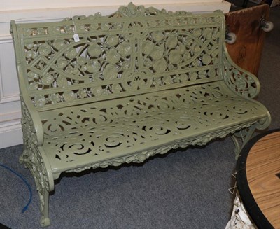 Lot 1191 - A reproduction green painted metal garden seat, 130cm wide