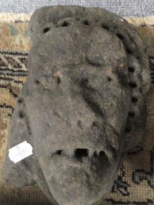 Lot 1193 - A carved stone mask, probably medieval, 26cm high; and a later carved stone support in the form...