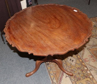 Lot 1200 - A 19th century mahogany piecrust top tripod table