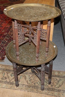Lot 1205 - Two brass Eastern folding tray top tables