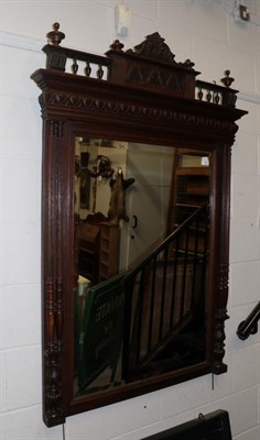 Lot 1218 - ^ A late 19th century oak bevelled glass mirror, 149cm by 90cm