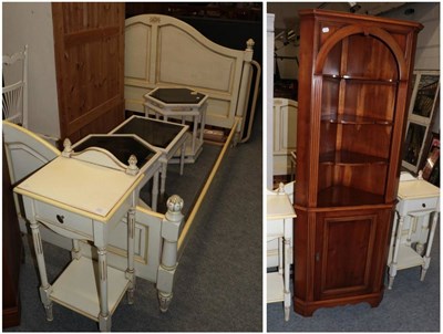 Lot 1225 - A reproduction cream painted king size bed, with panelled headboard; a pair of matching bedside...