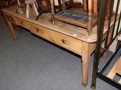 Lot 1234 - ^ A Victorian pine kitchen table, fitted four drawers, raised on square chamfered legs, 216cm...