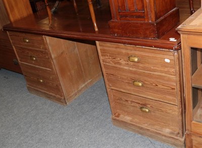Lot 1241 - ^ A Victorian pitch pine desk, fitted with six drawers, later pine top, 191cm wide