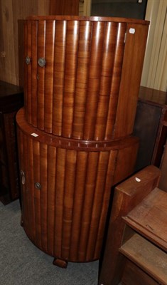 Lot 1245 - A 1930s walnut bow fronted cocktail cabinet