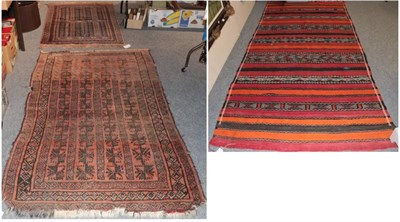 Lot 1270 - Baluch Prayer Rug, the field of narrow columns flanking a hooked Mihrab enclosed by multiple narrow