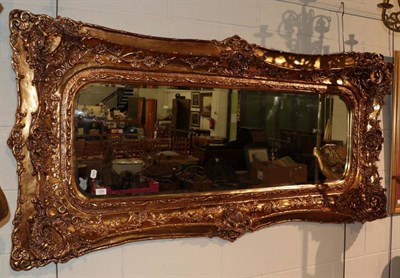 Lot 1285 - ^ A modern gilt composition bevelled glass mirror, 90cm by 180cm