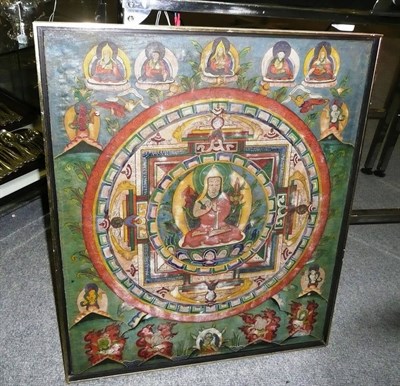 Lot 1261 - A Tibetan Thanka, late 19th/early 20th century, painted on silk, with central wheel centred by...