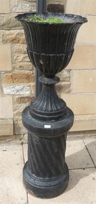 Lot 1296 - ^ A black painted cast metal pedestal garden urn, 42cm by 124cm
