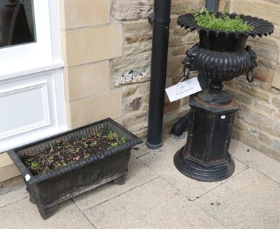 Lot 1297 - ^ A pair of black painted cast metal rectangular garden troughs, 70cm by 35cm by 55cm