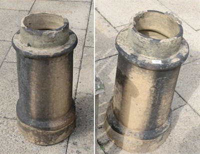 Lot 1301 - ^ A pair of circular chimney pots, 67cm high