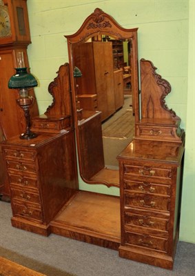 Lot 1321 - ^ A Victorian figured walnut dressing table with pivoting central mirror, 152cm wide