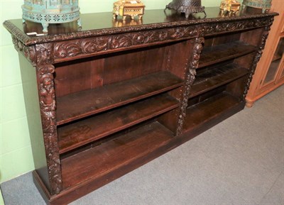 Lot 1328 - ^ A late Victorian carved oak dwarf bookcase (measurements to add)