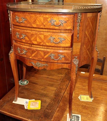 Lot 1347 - ^ A Louis XV style tulipwood and parquetry decorated D shaped three drawer chest, 62cm wide