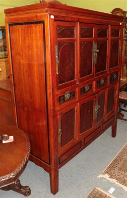 Lot 1348 - ^ A Chinese lacquered cupboard with eight assorted doors, 137cm wide