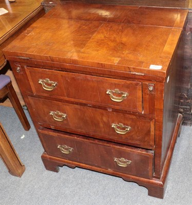 Lot 1352 - An 18th century style walnut veneered three height chest of drawers