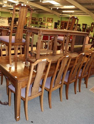 Lot 1353 - A reproduction dining room suite comprising extending dining table; ten chairs, including two...