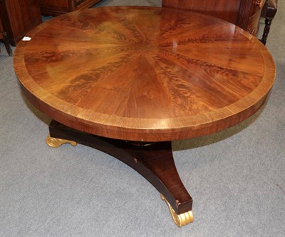 Lot 1359 - A Victorian flame mahogany and rosewood crossbanded circular breakfast table