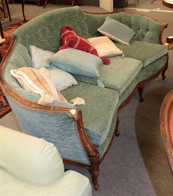 Lot 1365 - ^ A late 19th century walnut framed three seater settee, upholstered in buttoned green chenille...