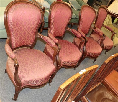 Lot 1367 - ^ A set of four late 19th century rosewood framed fauteuils, upholstered in red floral fabric, 60cm