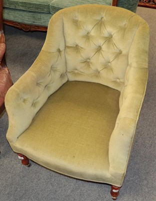 Lot 1368 - A Victorian tub shaped armchair upholstered in buttoned green velvet, 63cm wide