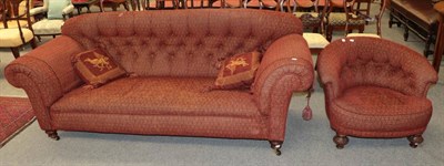 Lot 1374 - A Victorian Chesterfield sofa and a Victorian armchair upholstered to match (2)