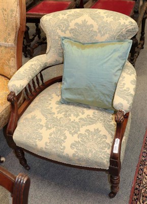 Lot 1378 - ^ A Victorian walnut framed armchair recovered in blue and cream floral fabric, 66cm wide