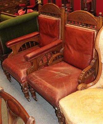 Lot 1380 - A late Victorian gentleman's armchair covered in warm red leather, 65cm wide; and a smaller...