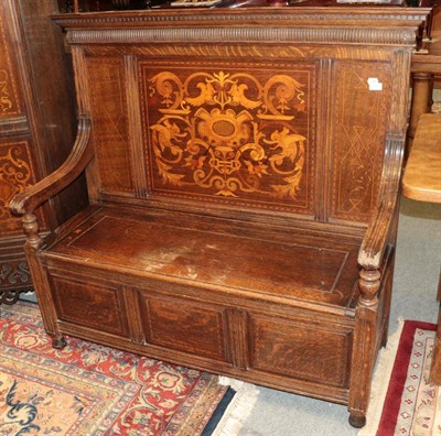 Lot 1391 - ^ A late Victorian oak and marquetry inlaid hall seat, the back support with a marquetry inlaid...