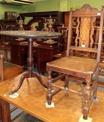 Lot 1393 - ^ A George III oak flip top tripod table, later carved; and an oak hall chair (2)