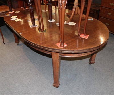 Lot 1401 - An Oak extending ding table circa 1900, with two additional leaves, with square chamfered legs,...