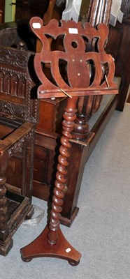 Lot 1413 - A Victorian walnut music stand, with spiral turned support, 135cm high