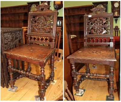 Lot 1419 - ^ A pair of Victorian carved oak hall chairs