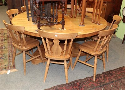 Lot 1420 - ^ A set of eight pine spindle back kitchen chairs with moulded seats