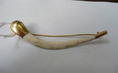 Lot 1274 - A Gold Metal Mounted Tiger's Clavicle Bone, circa 1910, with simple metal tips and pin...